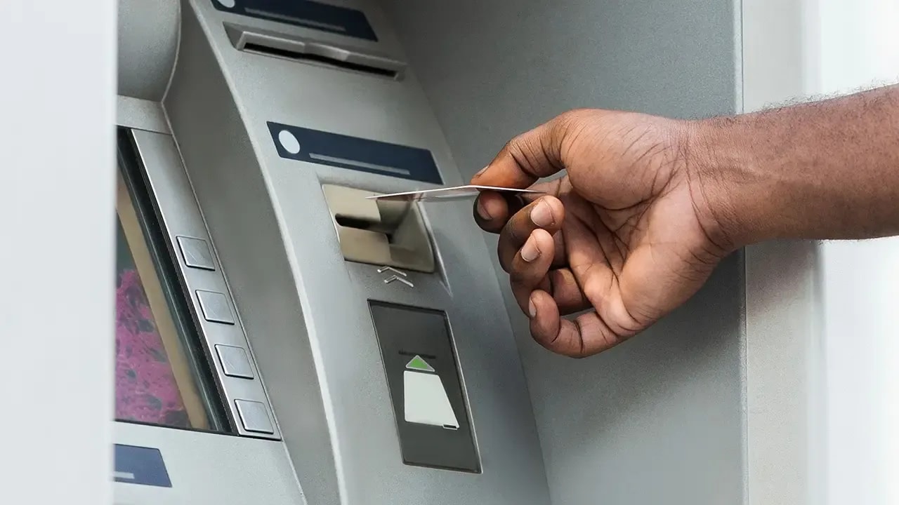 ATM fraud at the bank: a mysterious monkey hand in the dark
