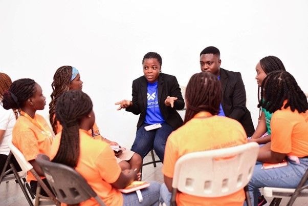 Standard Chartered volunteers mentor girls at the Empower Her Camp