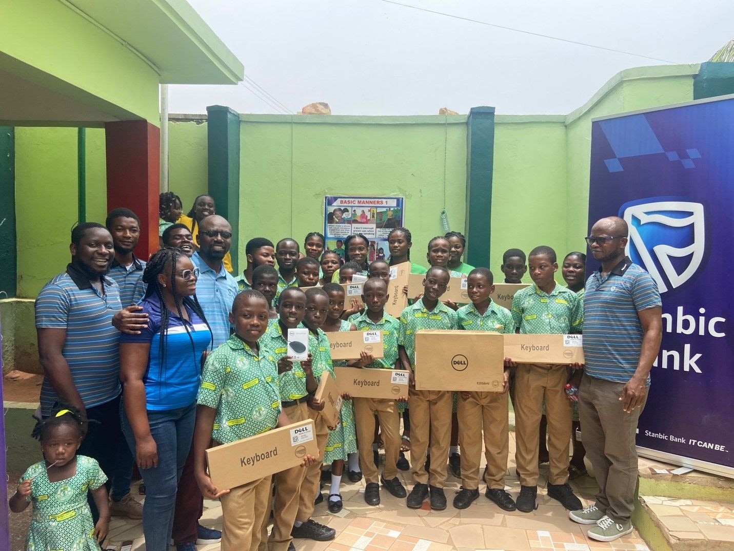 Stanbic Bank employees donate computers to Blessed Holy Child School