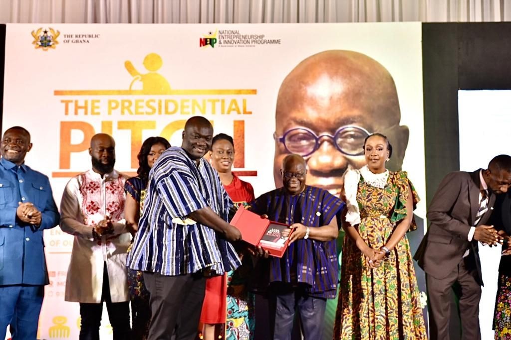 Richard Abbey Junior presents his memoir 'I Can Never Be Mad Again' to Prez Akufo-Addo