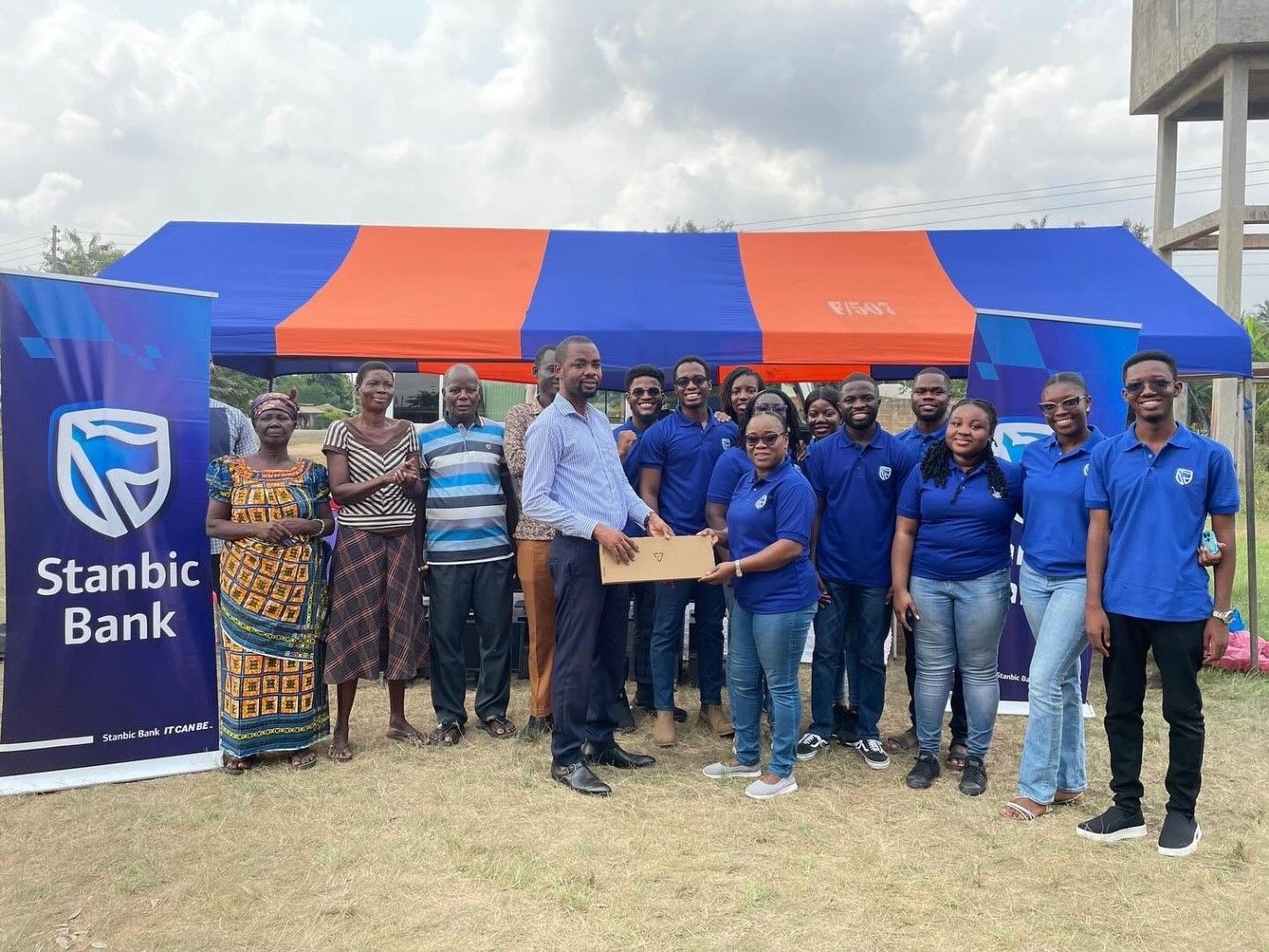 Stanbic graduate trainees donate computers to Lume-Avete Basic School