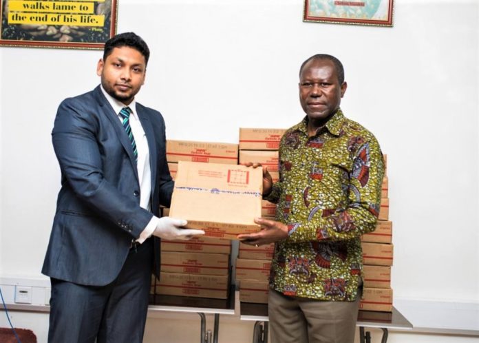 Country Head of ECOM, Muhammadu Muzzammil, presenting the soap to CEO of COCOBOD, Hon. Joseph Boahen Aidoo