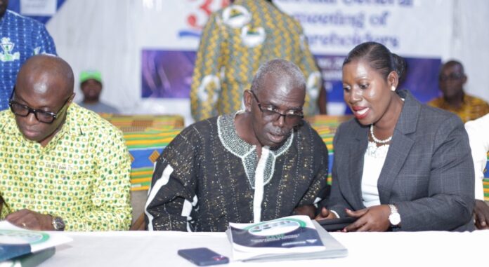 The CEO, Mrs Helen Adjei – Yankey conferring with the Board Chairman, Prof. Samuel Adjei-Nsiah during the meeting. Seated extreme left is the Managing Director, ARB Apex Bank PLC, Alex Kwasi Awuah