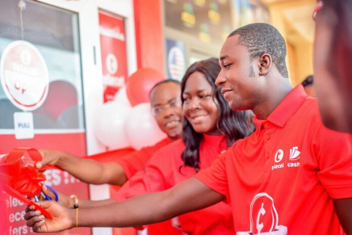 Dennis Asamoah, partner entrepreneur for new Abuakwa Community Shop cuts the ribbon with Mercy Akude, General Manager, Commercial Operations at Telecel Ghana